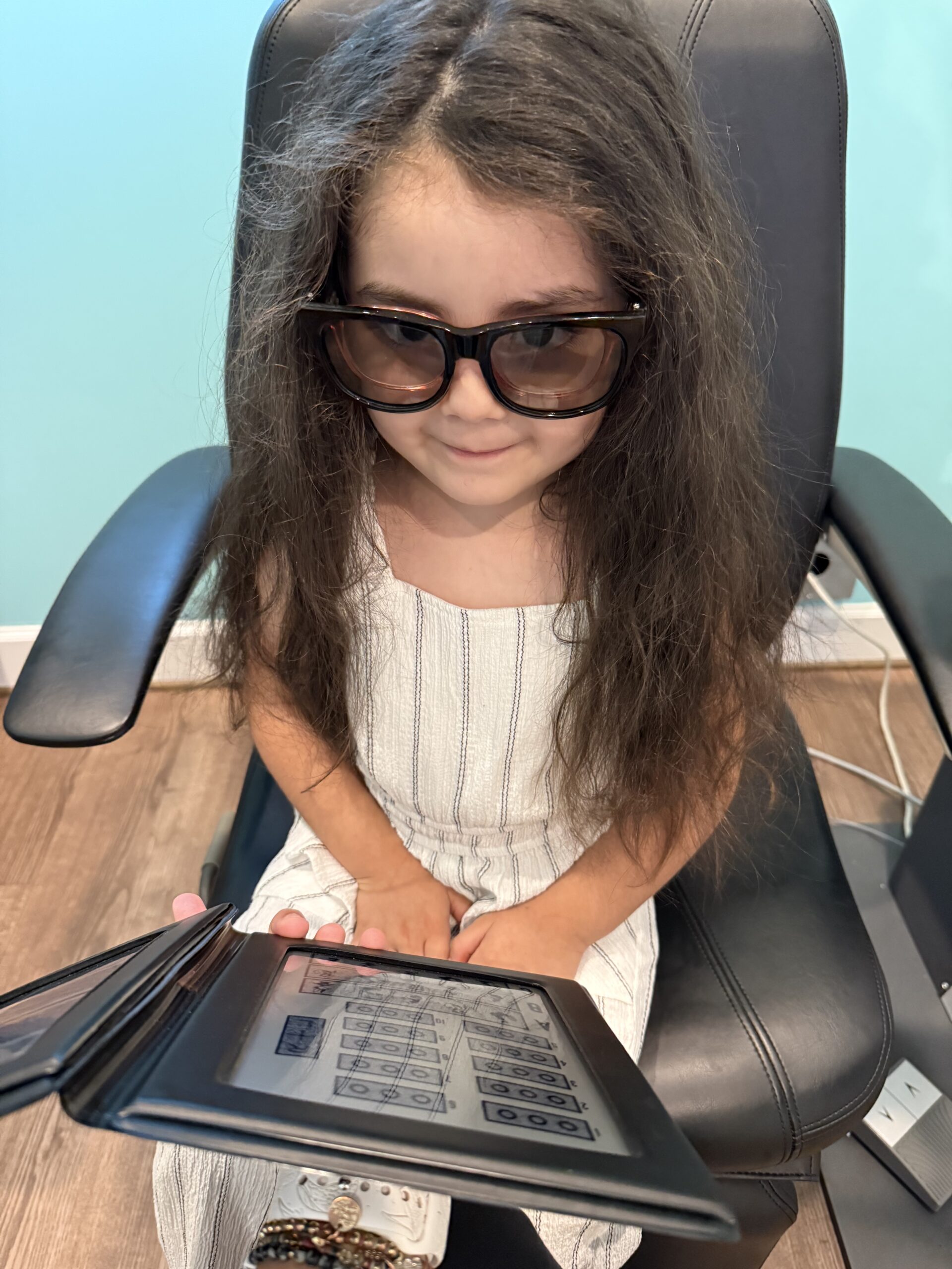 Child doing eye test to detect for common children’s vision problems