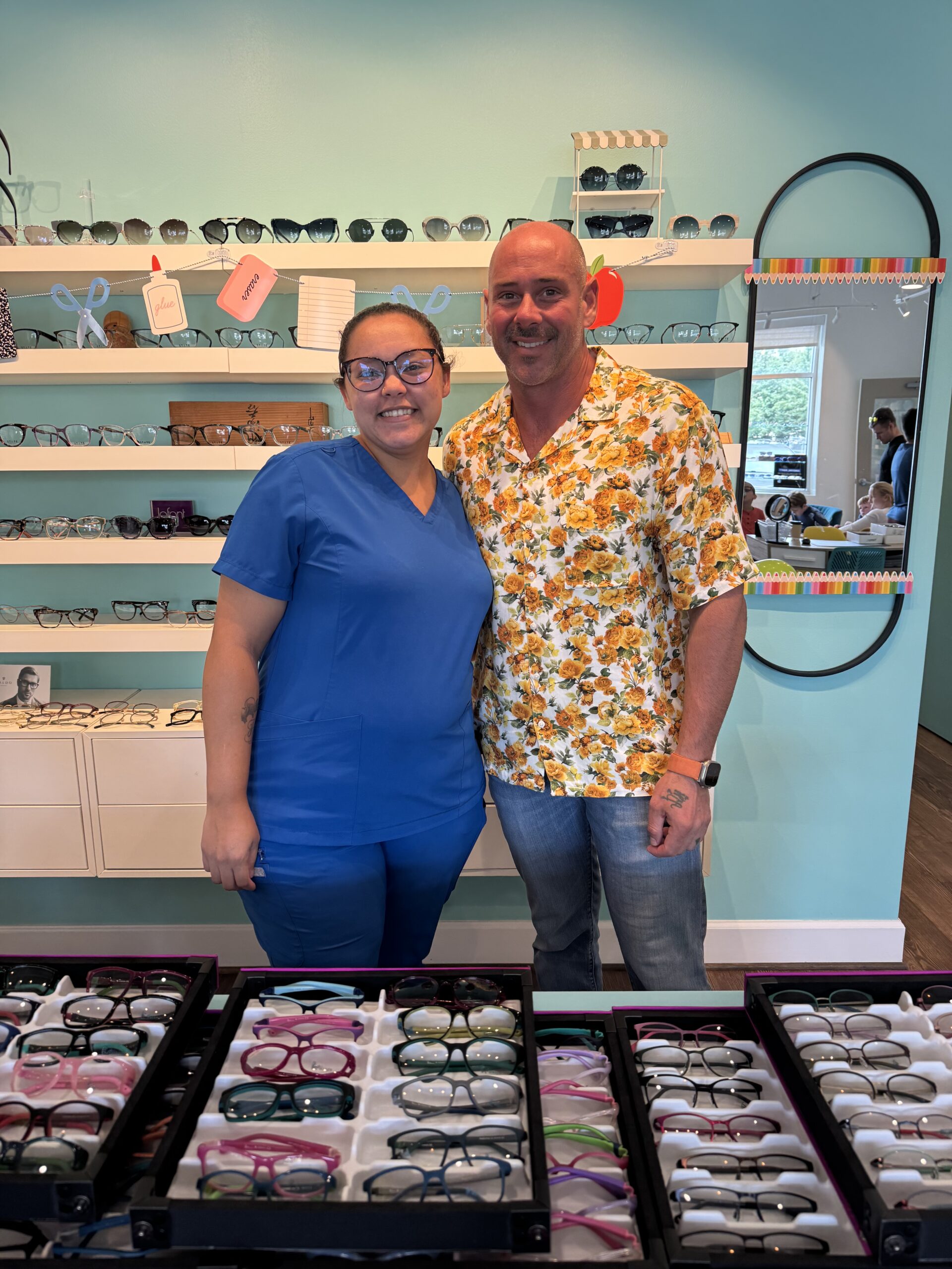 Navigation Eye Care optician and sales representative with latest styles for prescription eyeglass frames