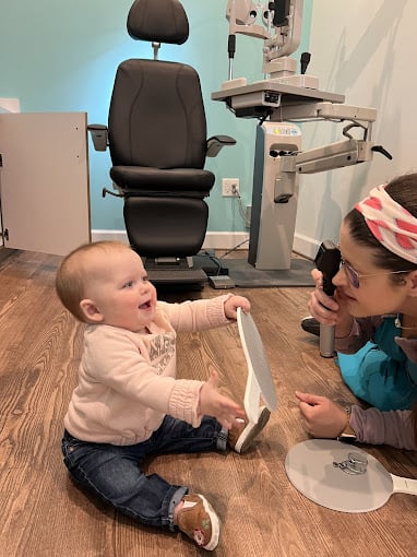 Eye doctor in Navigation Eye Care performing pediatric eye exam in Chesapeake VA