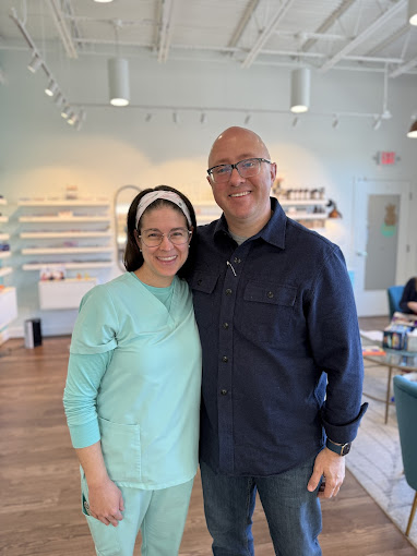 Dr. Teten and a satisfied patient at Navigation Eye Care optical boutique in Chesapeake VA