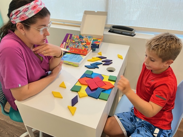 Child seen in Navigation Eye Care with eye doctor doing off screen activity for digital eye screen