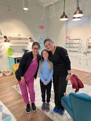 Dr. Teten with young patients in the optical boutique at Navigation Eye Care Chesapeake VA
