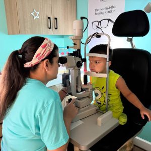 Dr. Teten performing a pediatric eye exam on a young child at Navigation Eye Care Chesapeake VA