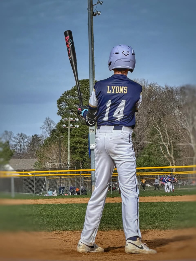 Young baseball player on the field after vision therapy improved depth perception and sports performance at Navigation Eye Care Chesapeake VA