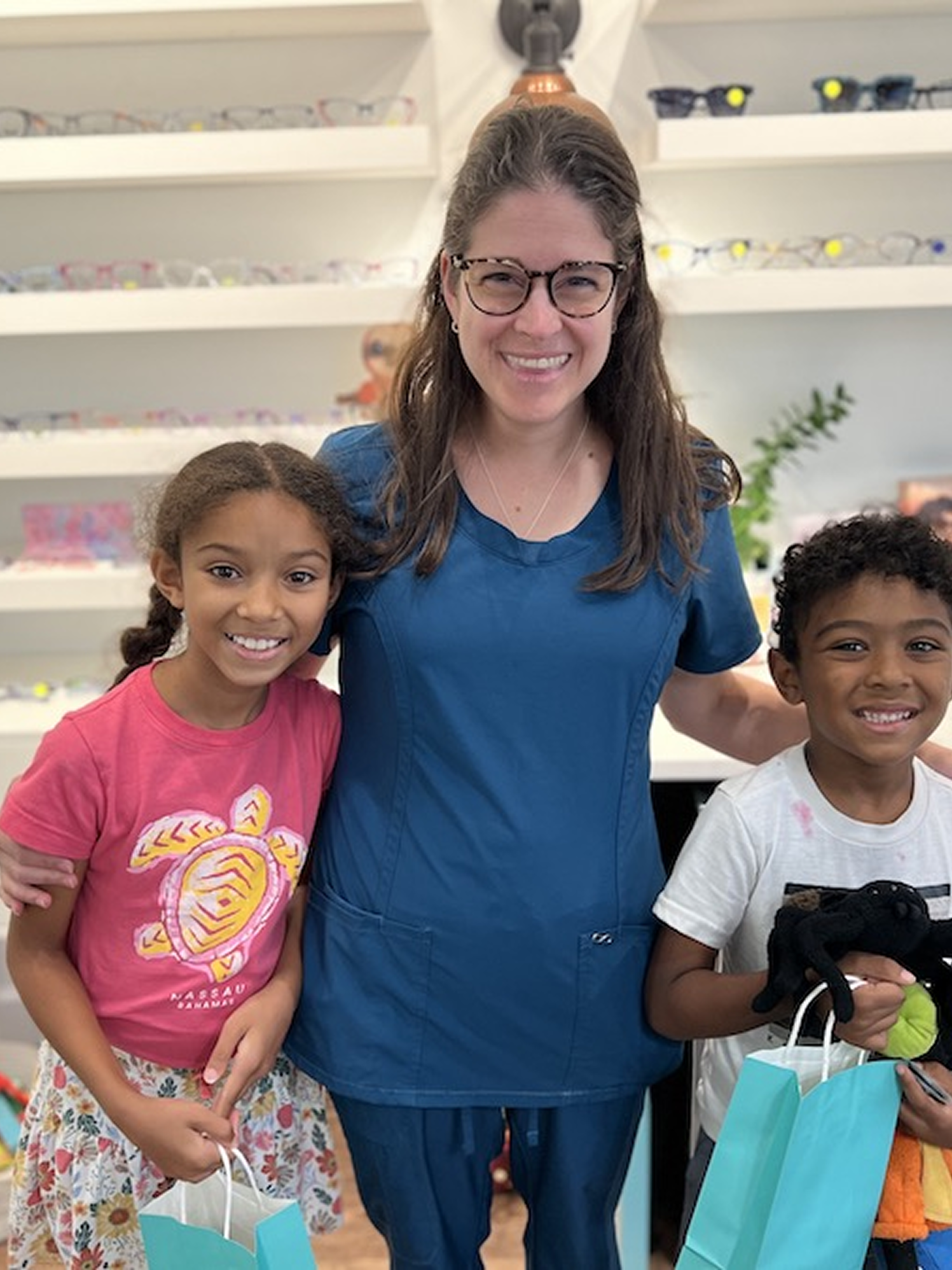 Dr. Amber Teten with young patients at Navigation Eye Care Chesapeake VA family-friendly optometry practice