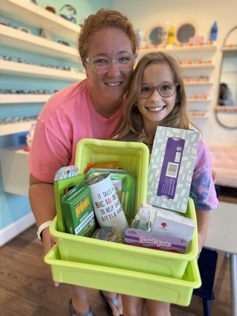 Mother and daughter with glasses smiling at Navigation Eye Care pediatric eye clinic in Chesapeake VA